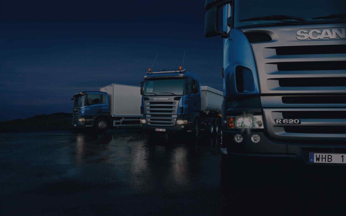 Dark-Three-trucks-on-blue-background-1200x750.jpg