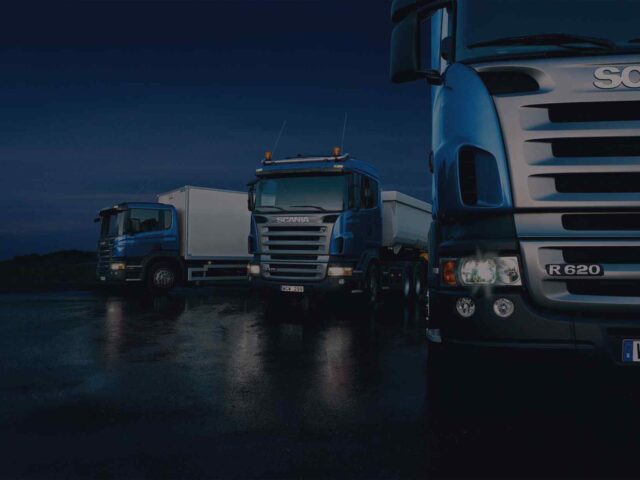 Dark-Three-trucks-on-blue-background-640x480.jpg