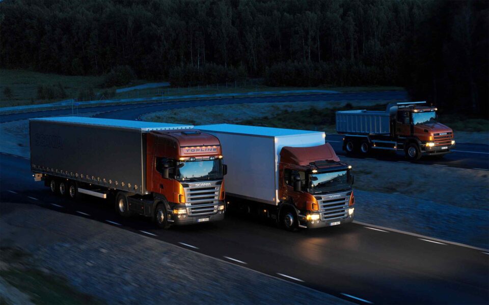 Three-orange-Scania-trucks.jpg